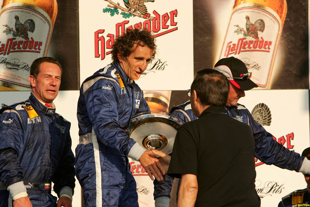 JOHNNY CECOTTO, ALAIN PROST Y NIGEL MANSELL EN EL PODIO DE LA CARRERA DE LEYENDAS EN NORISRING JOHNNY CECOTTO, ALAIN PROST Y NIGEL MANSELL EN EL PODIO DE LA CARRERA DE LEYENDAS EN NORISRING