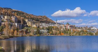 Panorama view over the St. Moritz lake in St. Moritz in autumn colours in Engadine, background the mountains