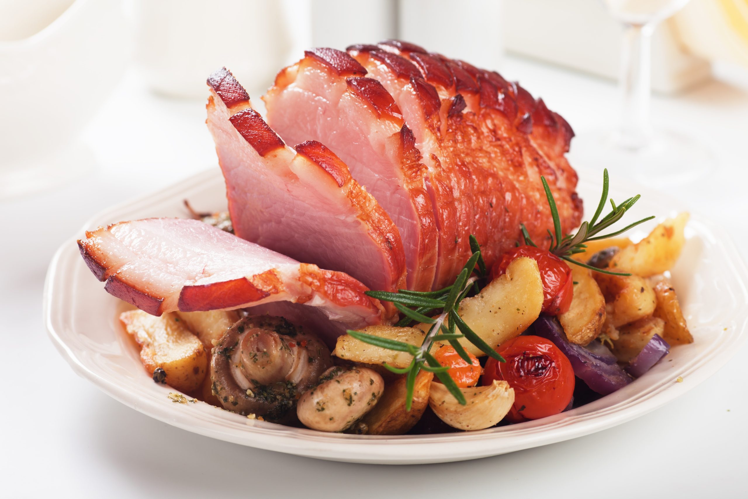 Roasted christmas ham with mushrooms and vegetables