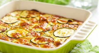 casserole with cheese and zucchini in baking dish