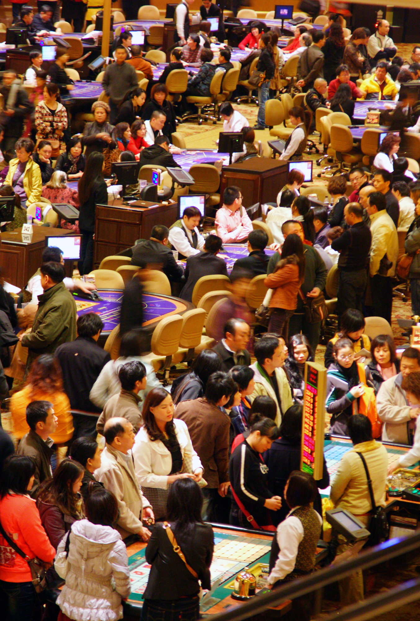 Customers gamble at a casino in Macao, China