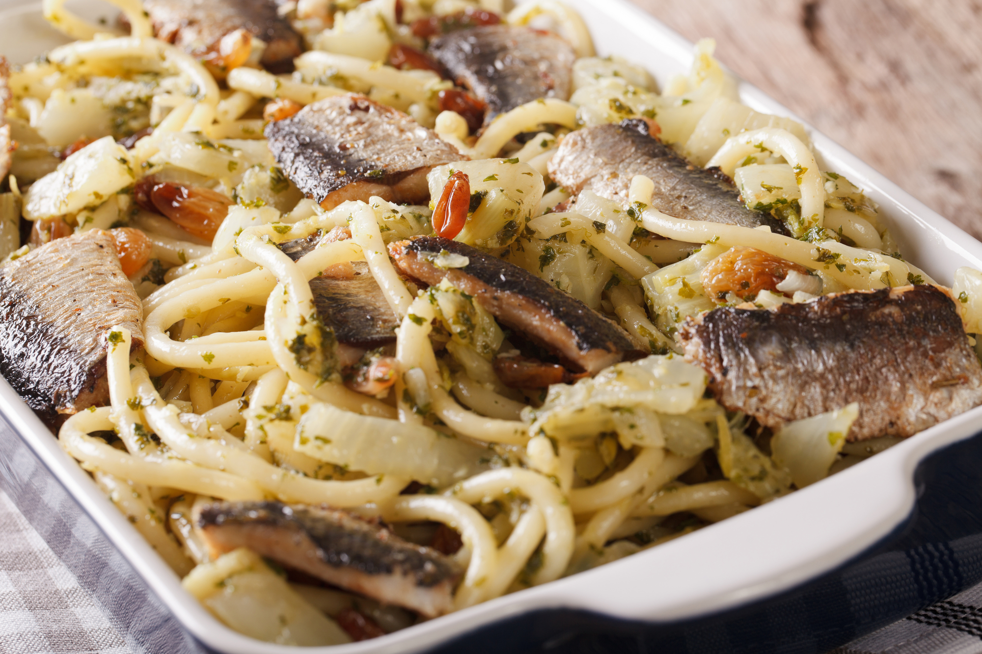 Italian pasta with sardines, fennel, raisins and pine nuts macro