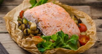 Salmon baked with Mediterranean vegetables in papillote