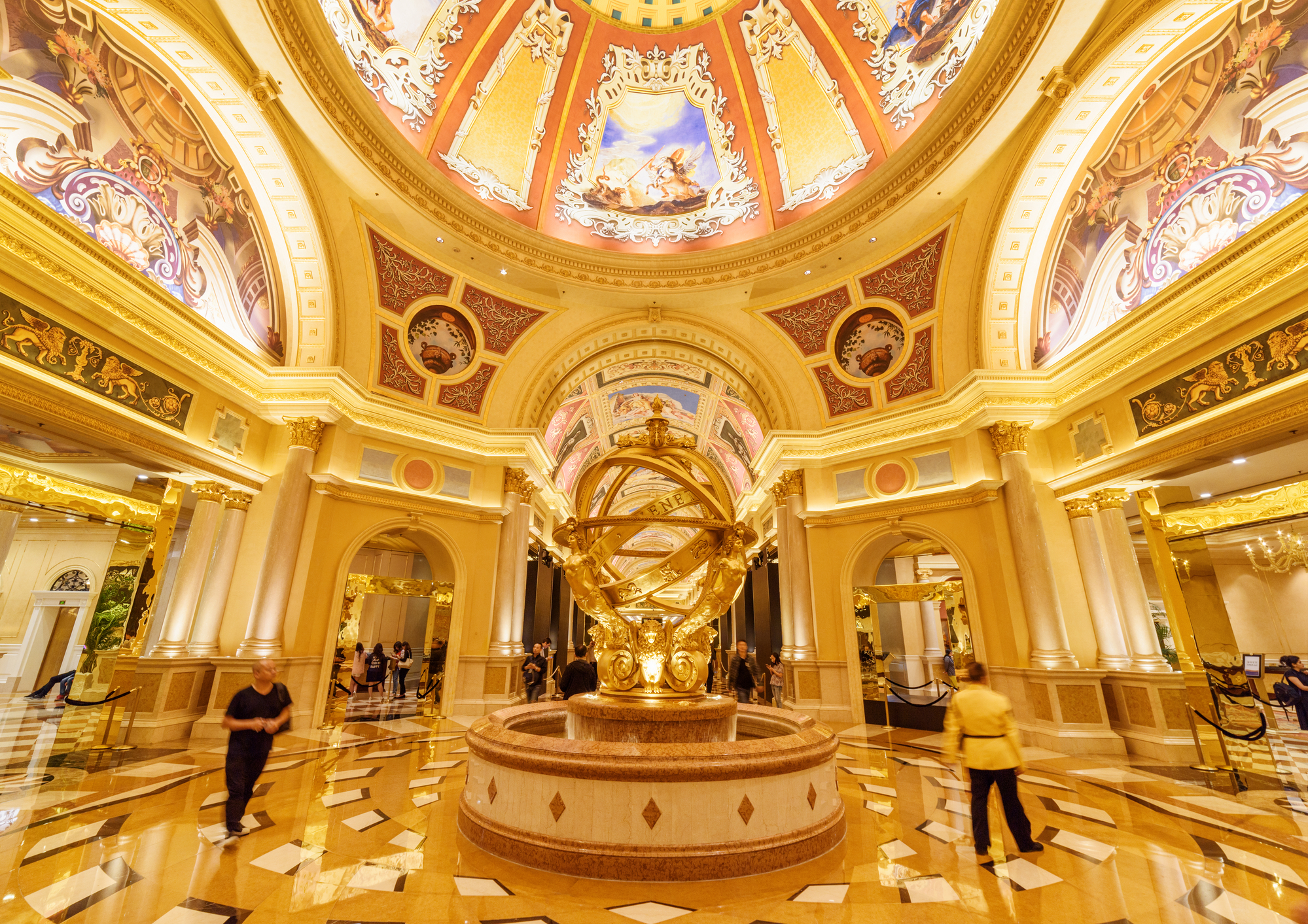 Macau: Fountain in lobby of the Venetian Macao. It is a luxury hotel, the famous shopping mall and the largest casino in the world. Beautiful interior.
