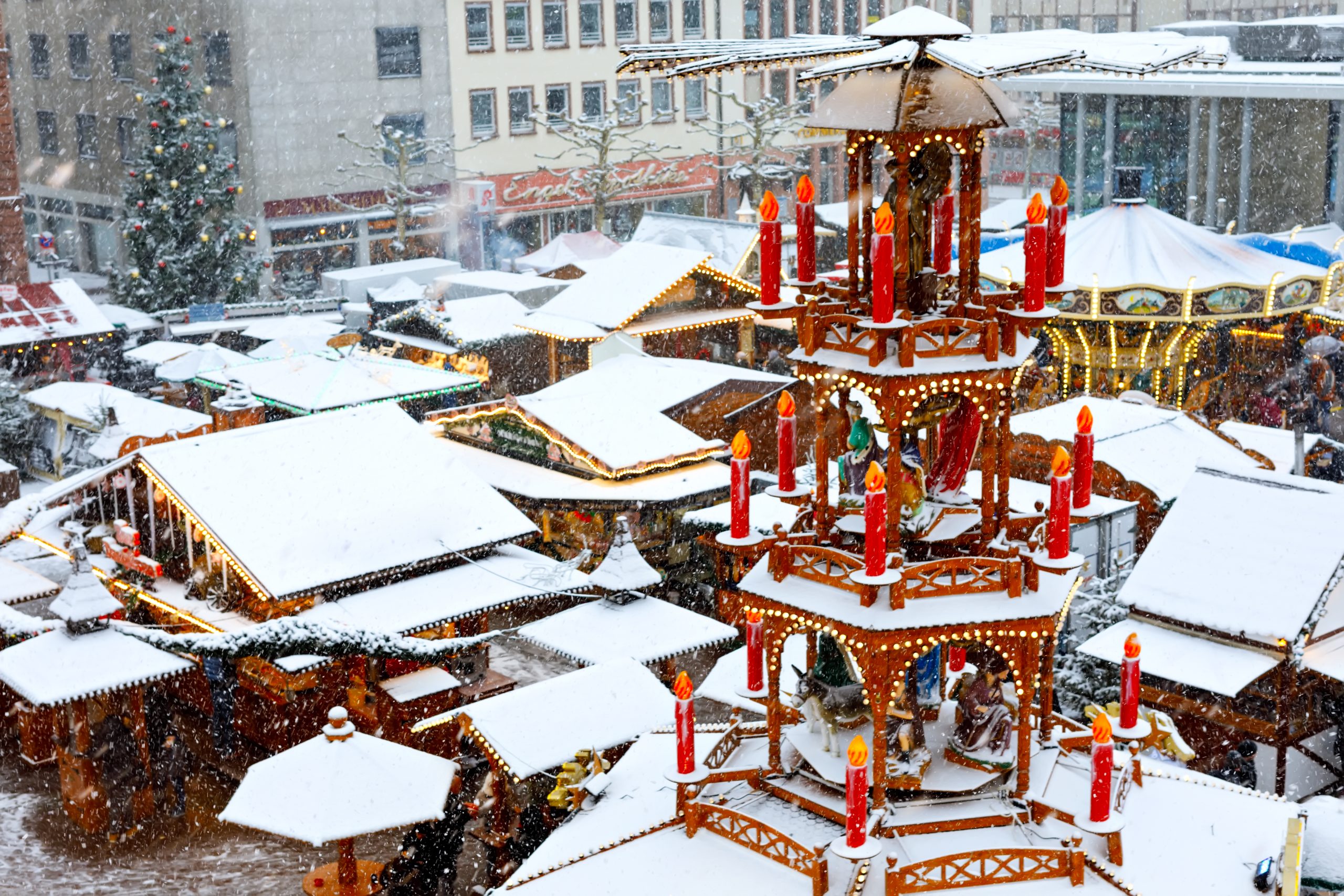 Traditional German christmas market in the historic center of Nuremberg, Germany during snow