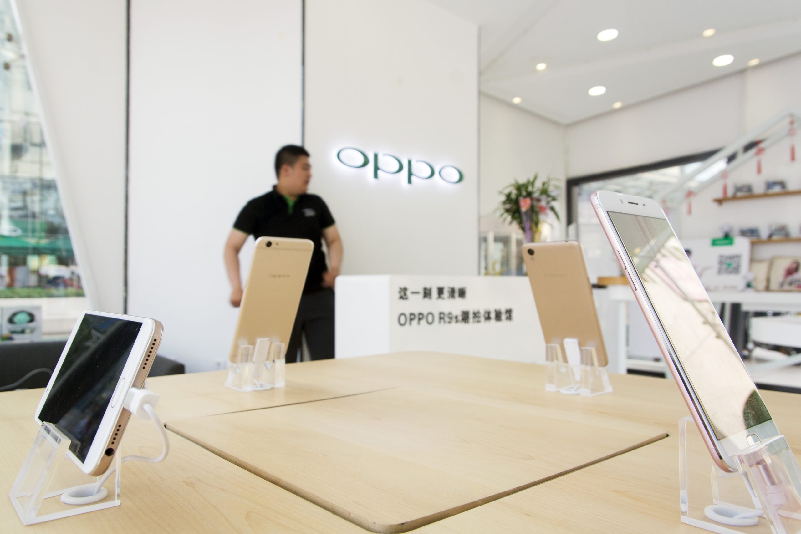 Smartphones are on display at a store of OPPO