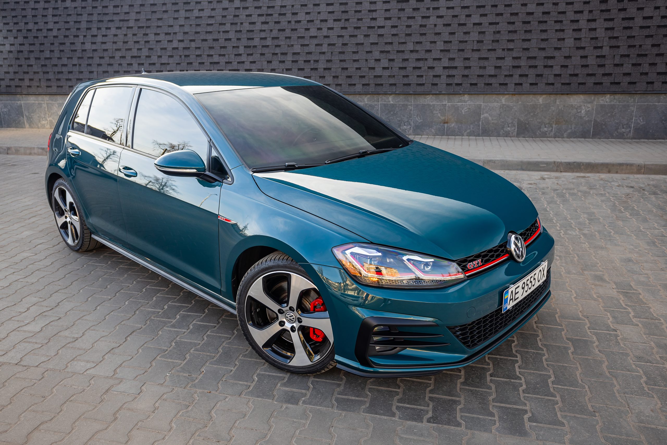 Krivoy Rog, Ukraine March 24, 2024: Photo of green car Volkswagen Golf GTI on the street.